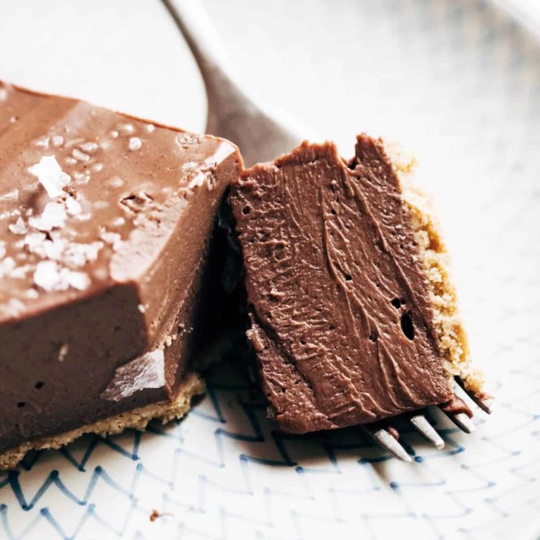 Vegan chocolate pie with a bite on a fork.